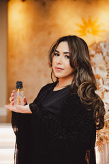 Nuble Oud attar bottle held in hand